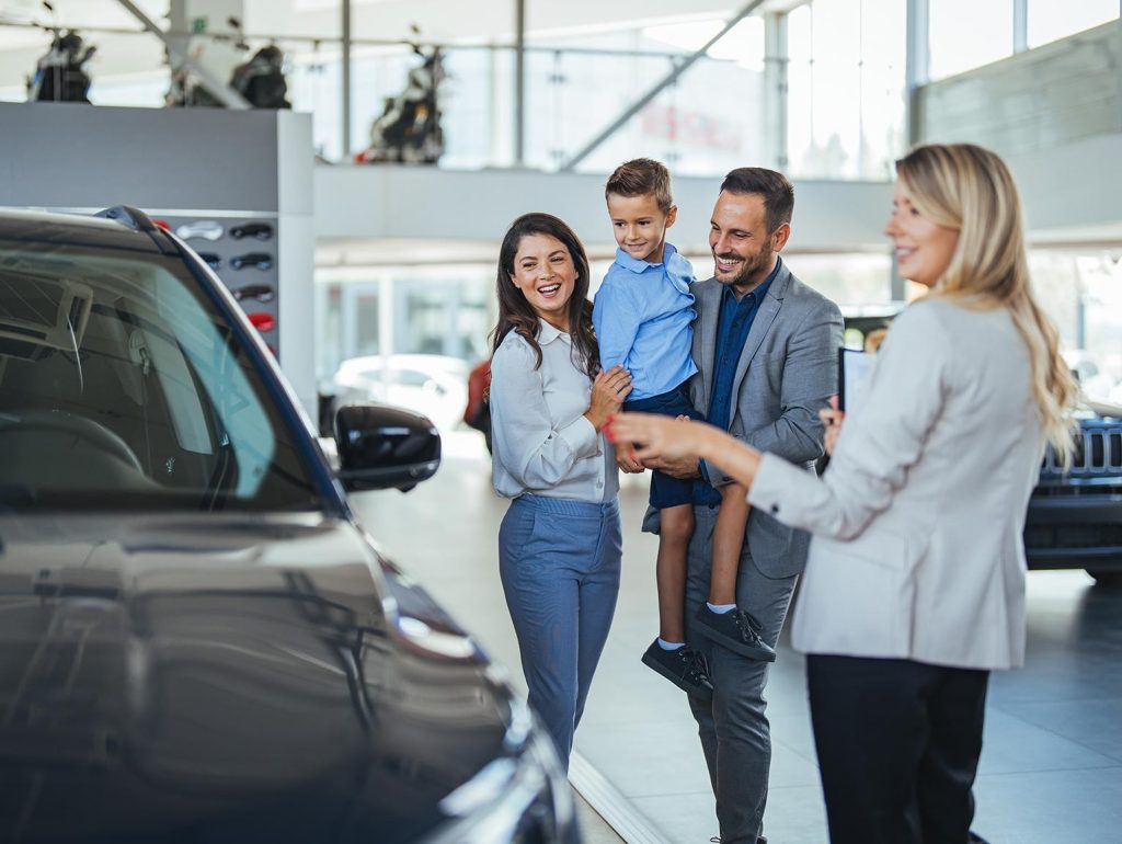 Family at a car dealership
