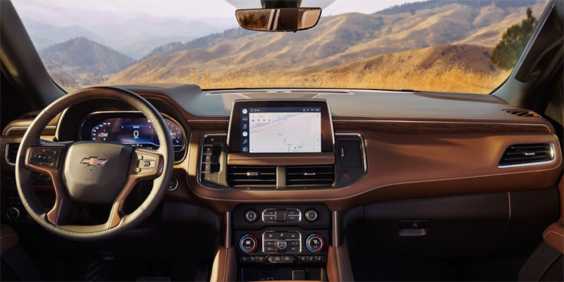 A Chevrolet Suburban showcases its sophisticated interior display panel, highlighting modern design and advanced technology