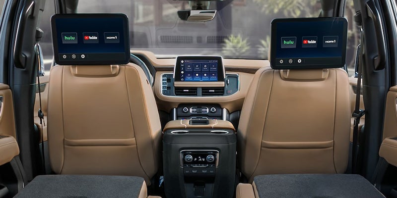A Chevrolet Suburban displays its luxurious interior seating, emphasizing modern design and cutting-edge technology