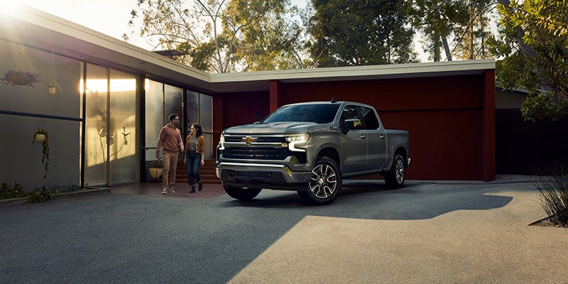 Chevy Silverado 1500 showcasing its sleek design and compact SUV structure, with a scenic background